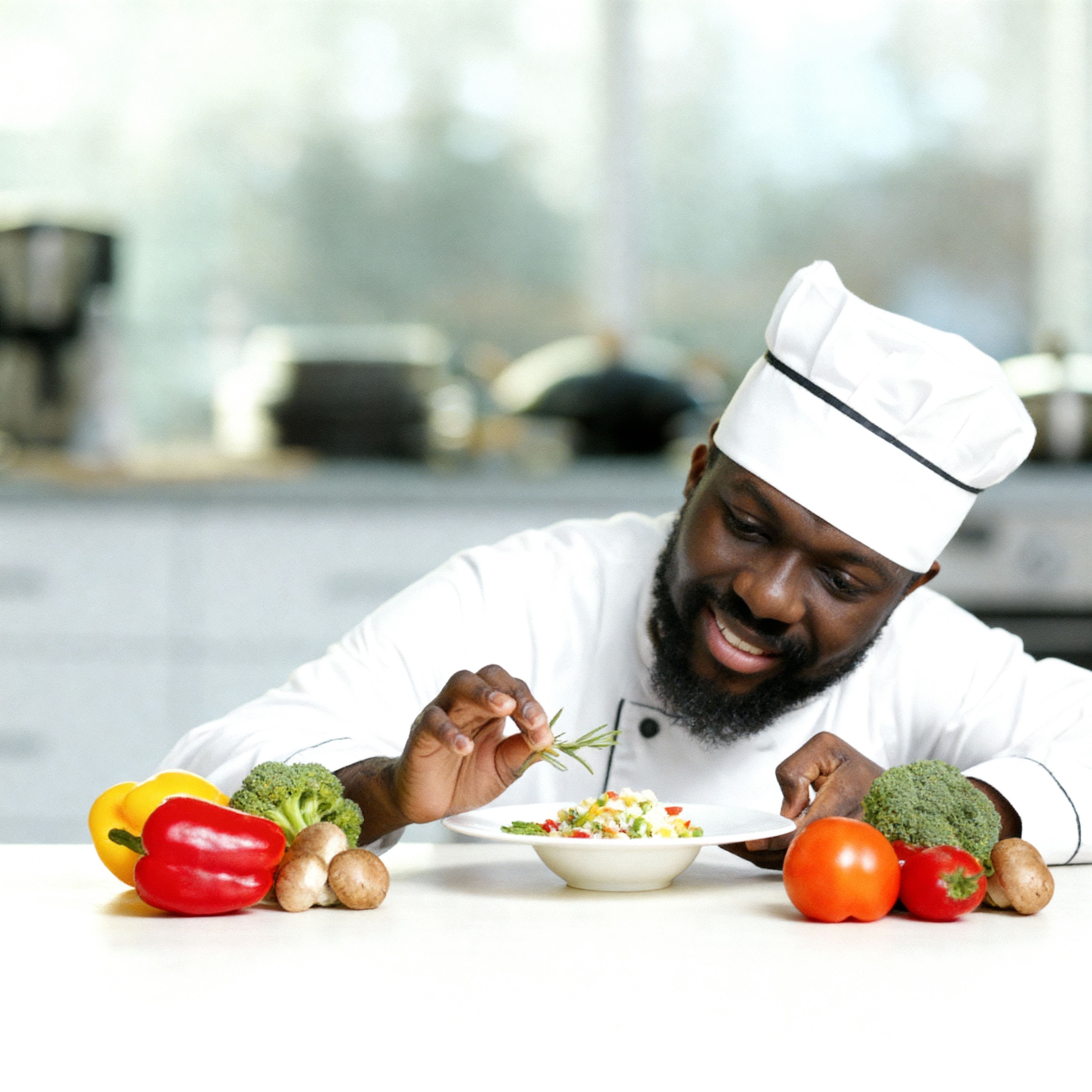 Chef carefully plating a meal, representing the Creators at Share